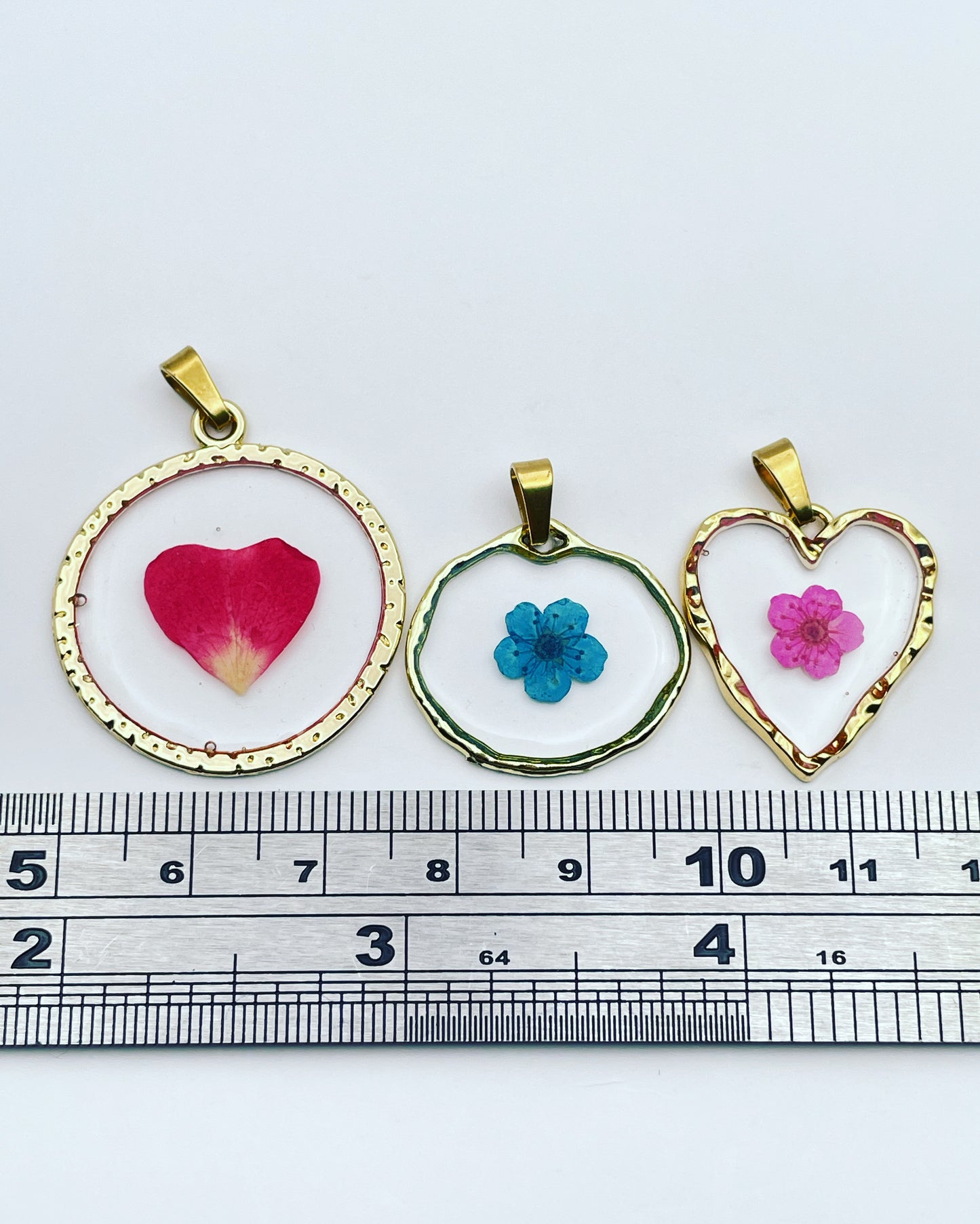 Black heart pendant necklace with real flowers and gold leaf