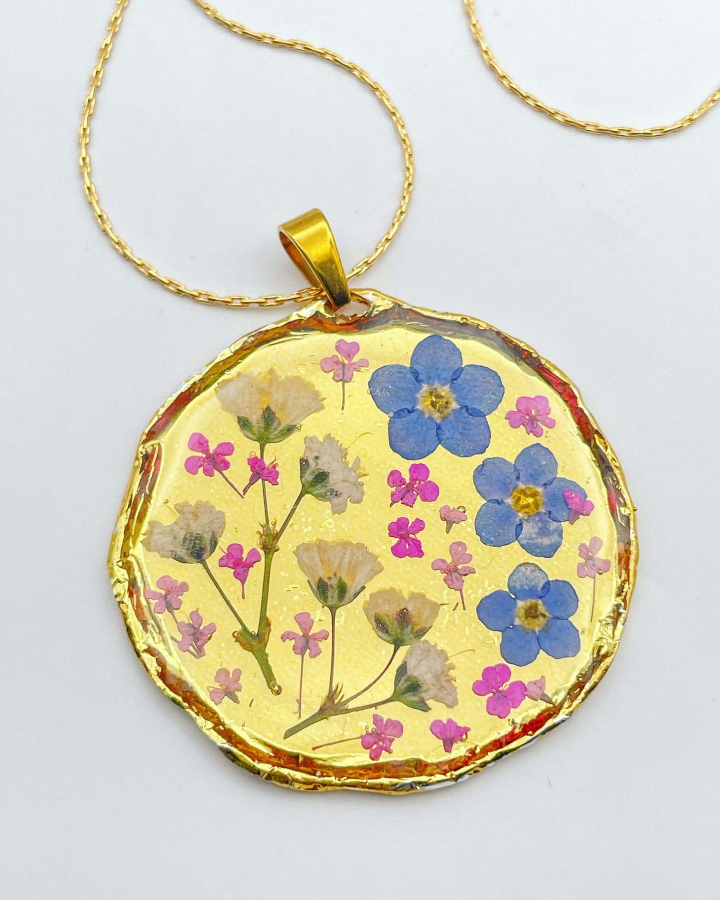 Gold necklace with forget-me-not and gypsophila