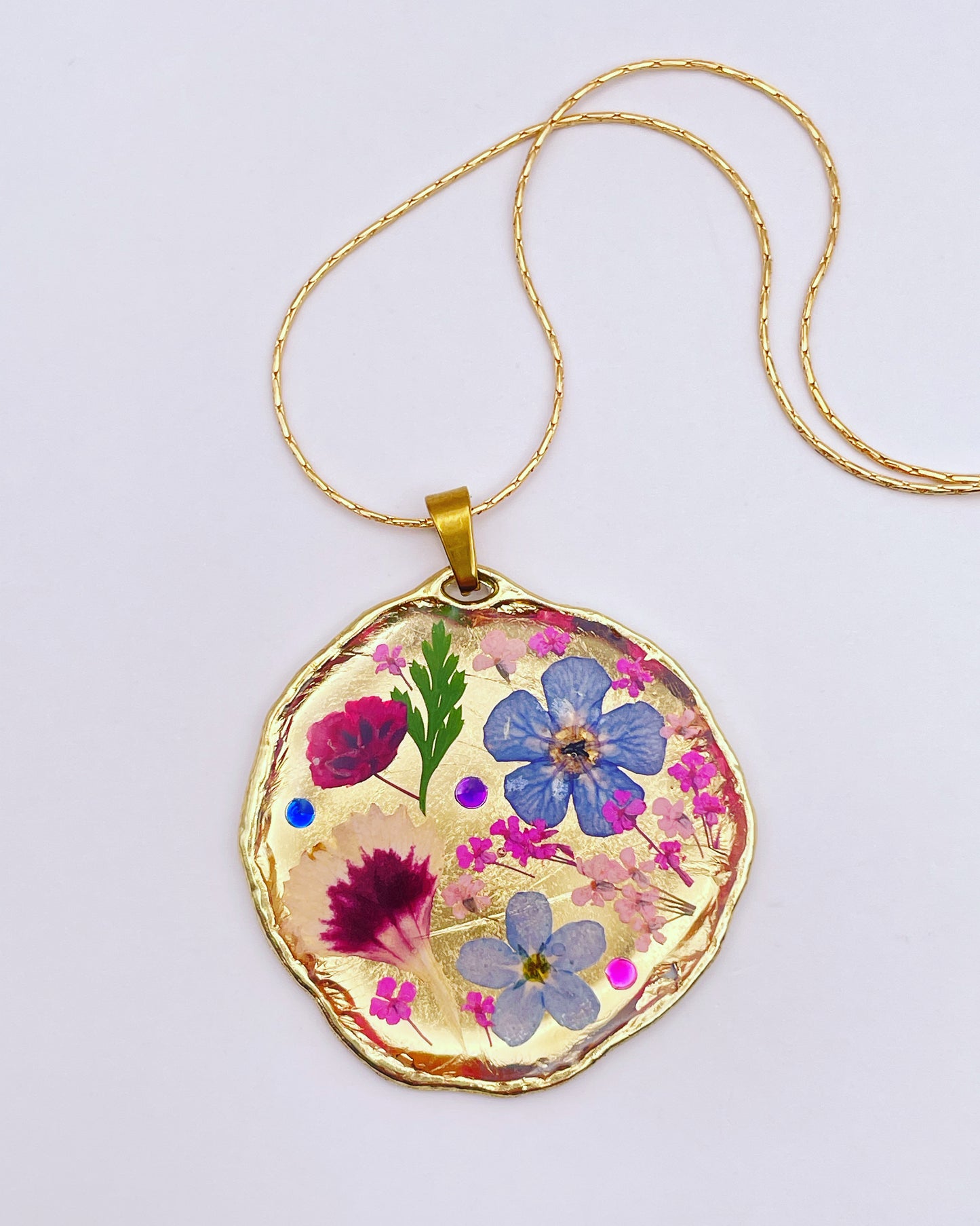 Statement necklace with real flowers and gold leaf