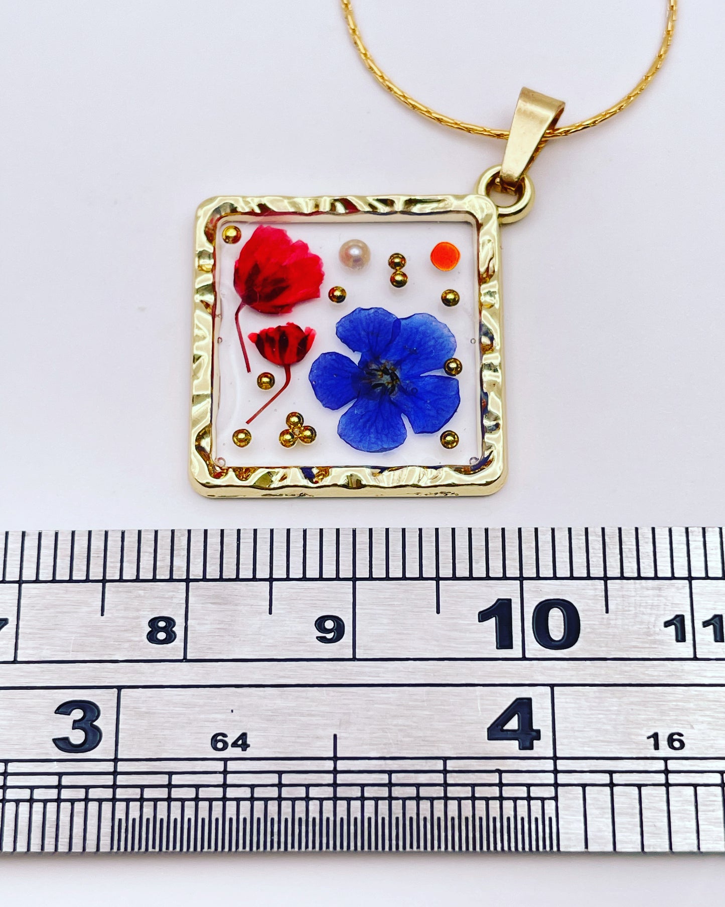 Square pendant necklace with red poppies and baby's breath