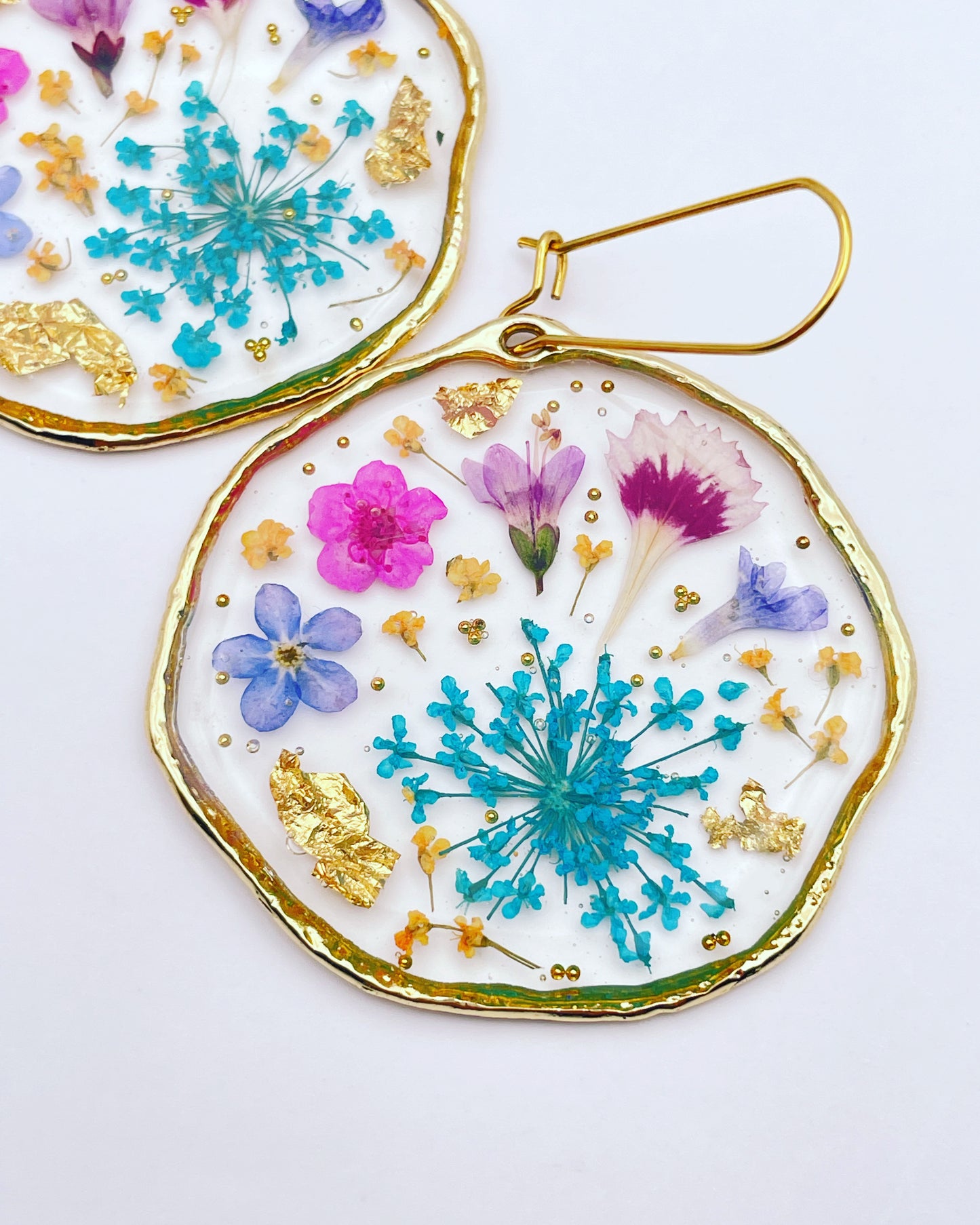 Statement earrings with blue and pink flowers