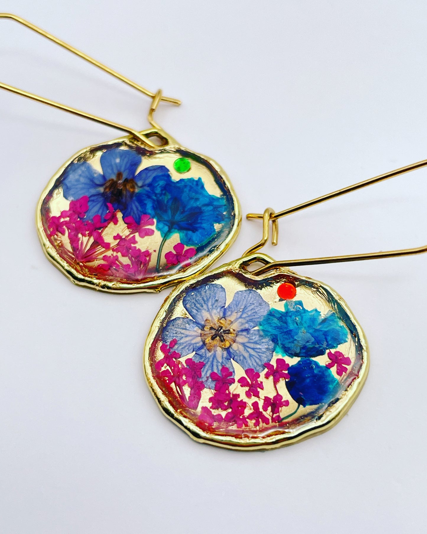 Gold dangle earrings with pink and blue flowers