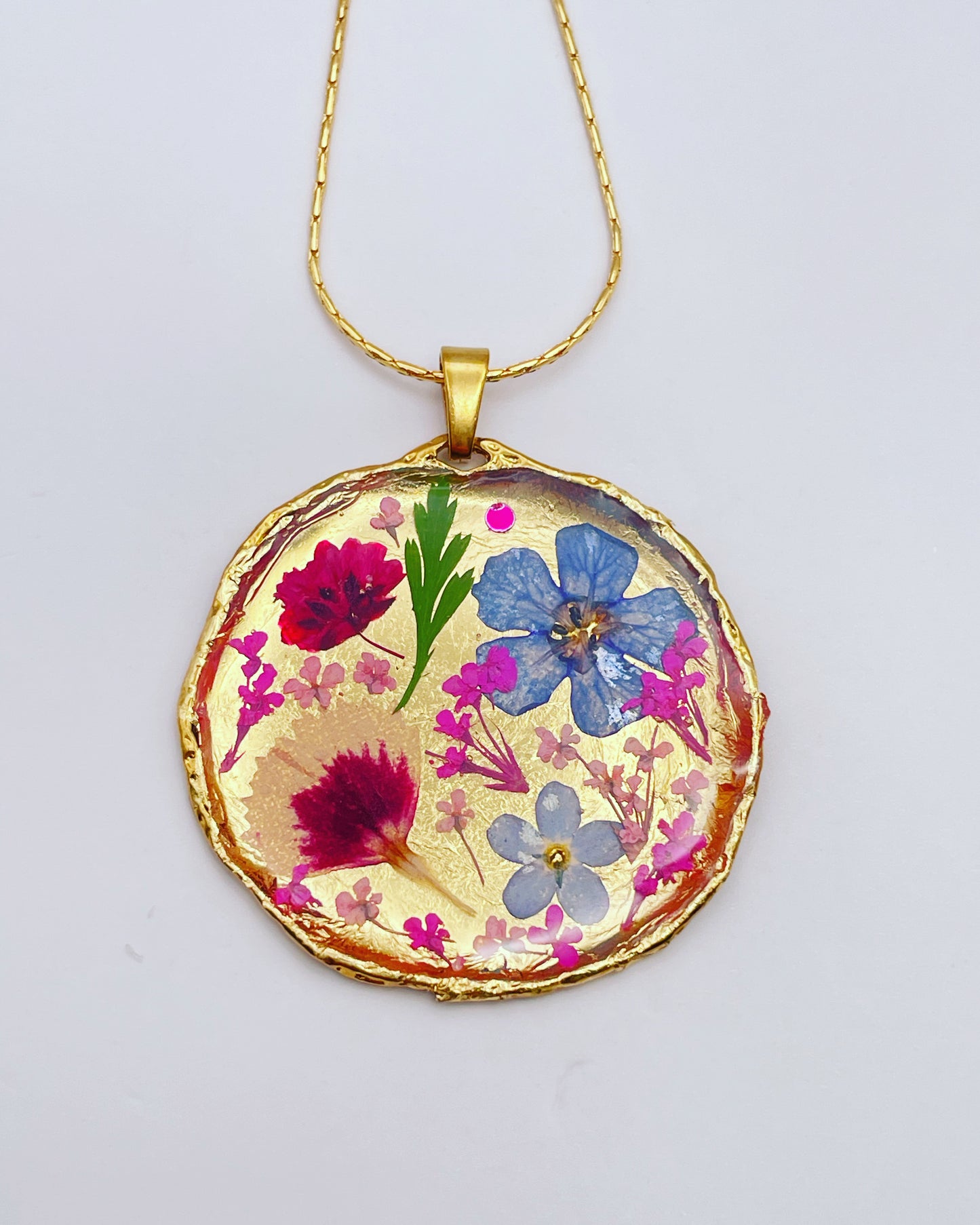 Statement necklace with real flowers and gold leaf