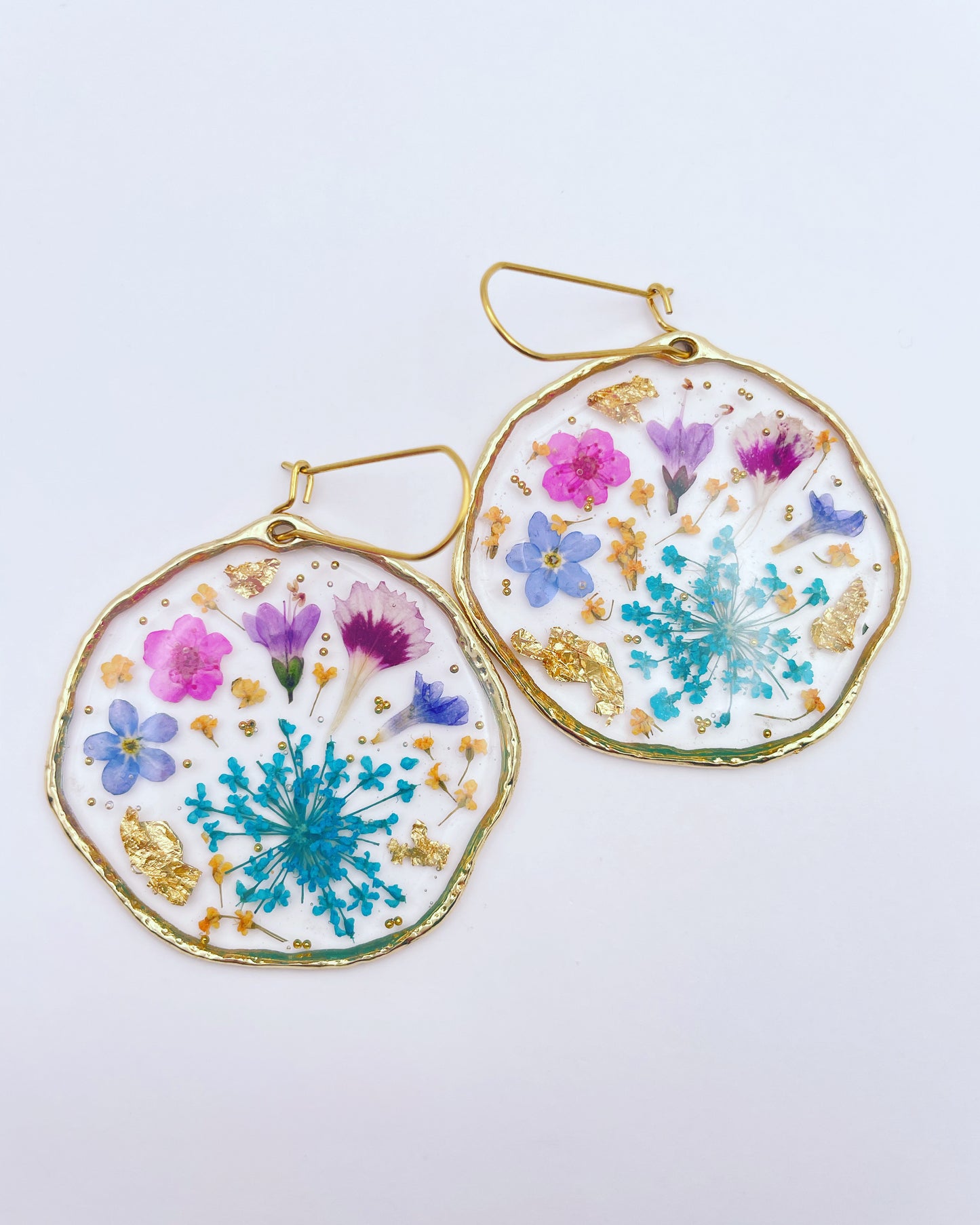 Statement earrings with blue and pink flowers