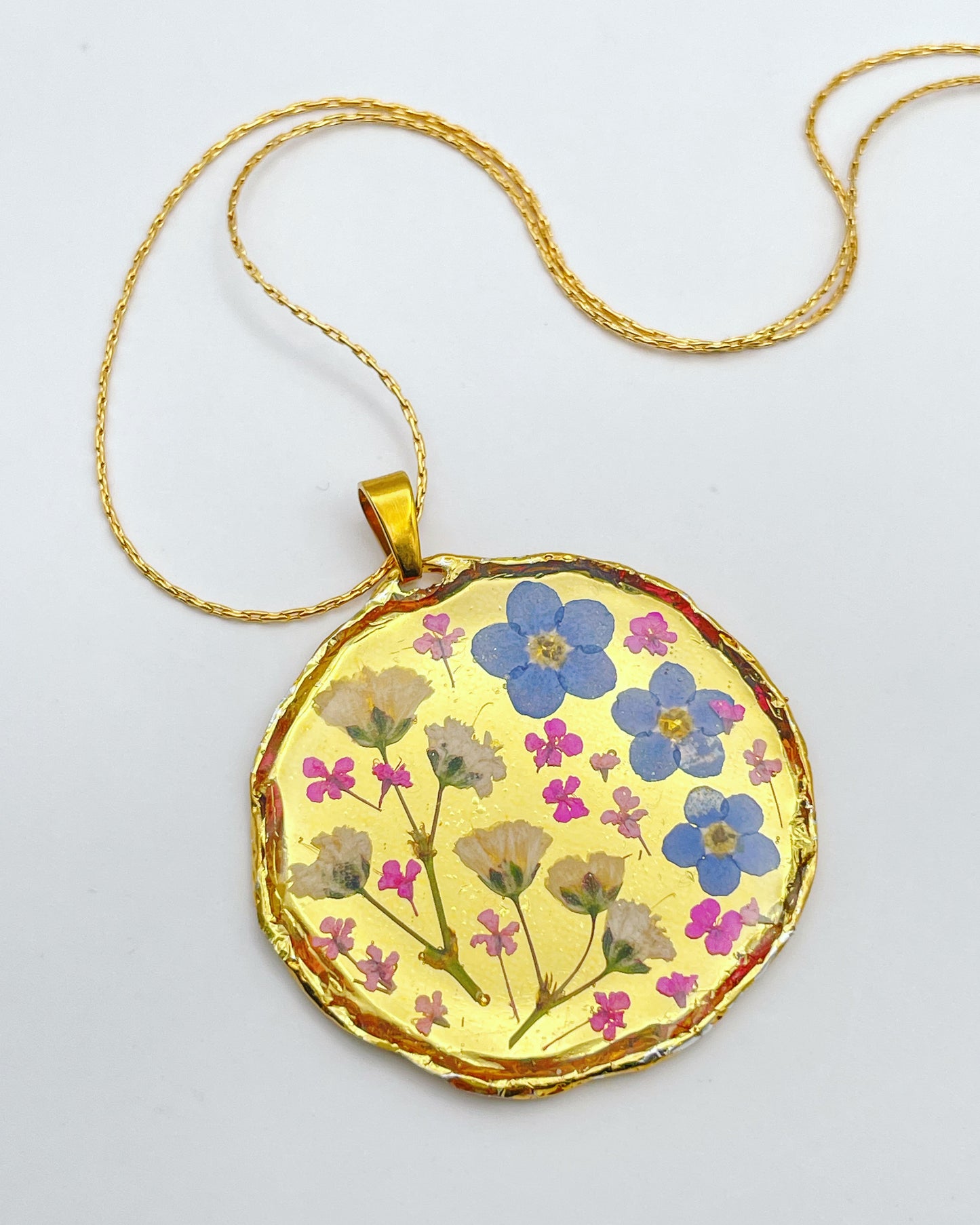 Gold necklace with forget-me-not and gypsophila
