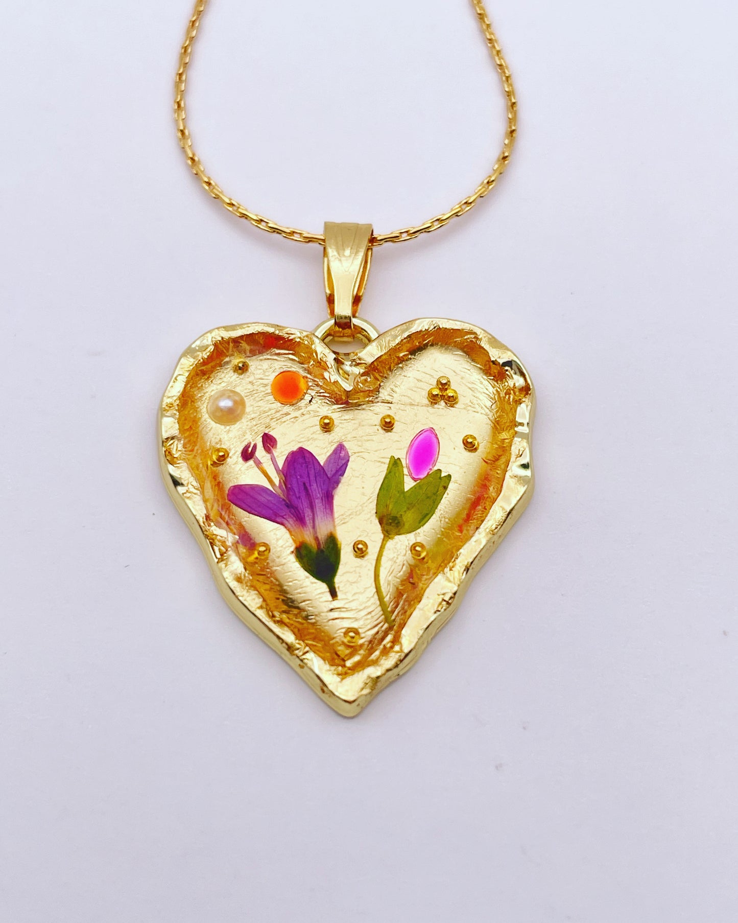 Gold heart necklace with pink flowers