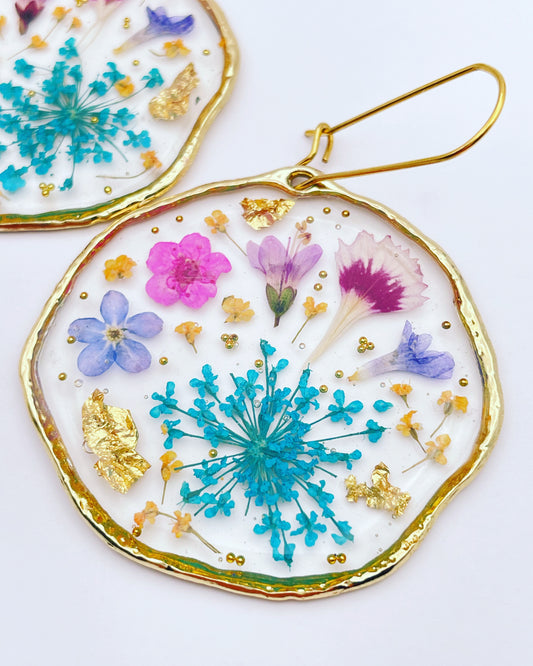 Statement earrings with blue and pink flowers