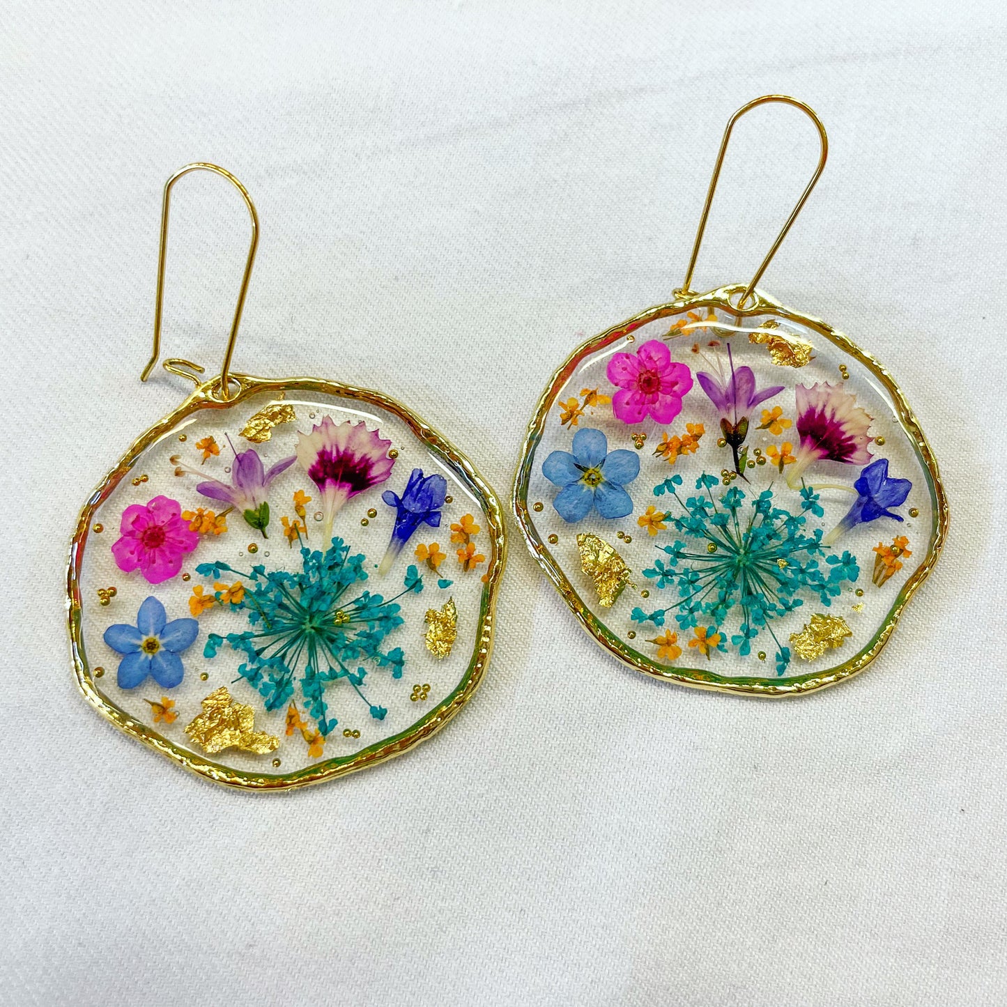 Statement earrings with blue and pink flowers