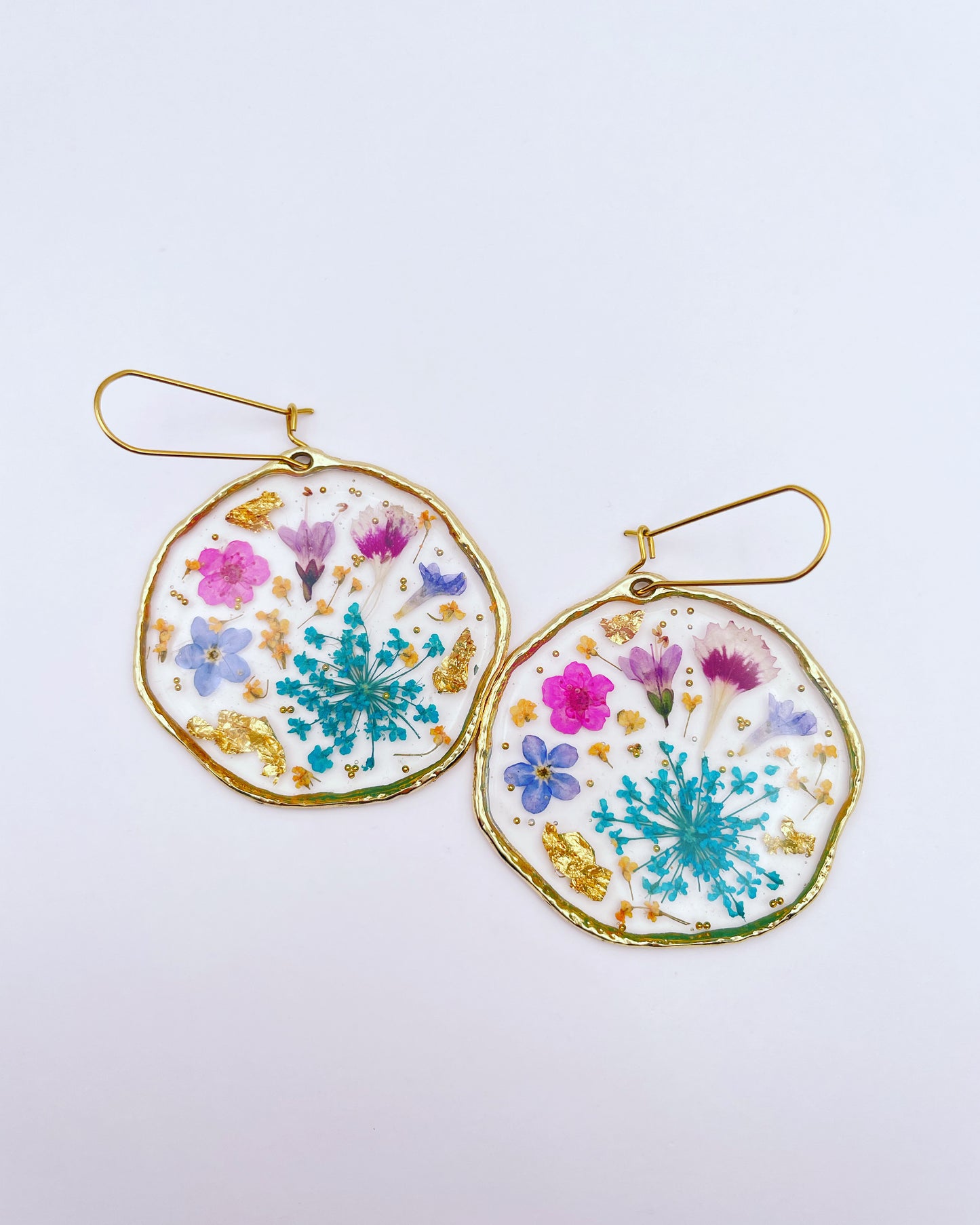 Statement earrings with blue and pink flowers