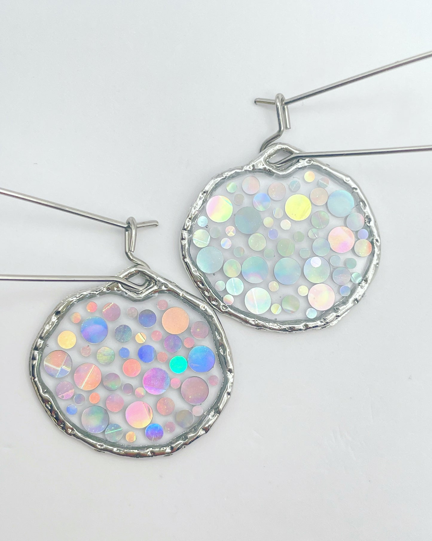 Small disco earrings with holographic silver sparkles