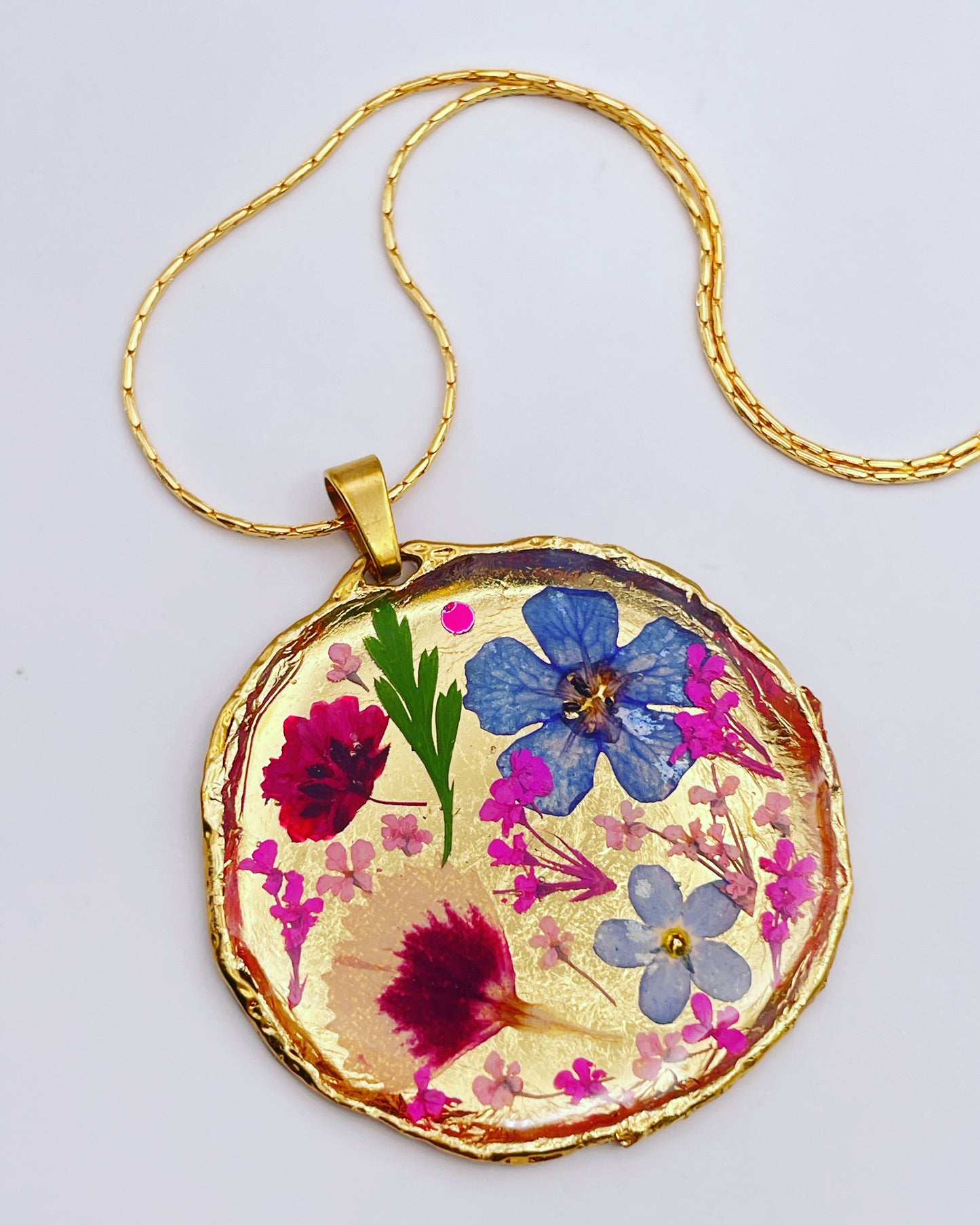 Statement necklace with real flowers and gold leaf