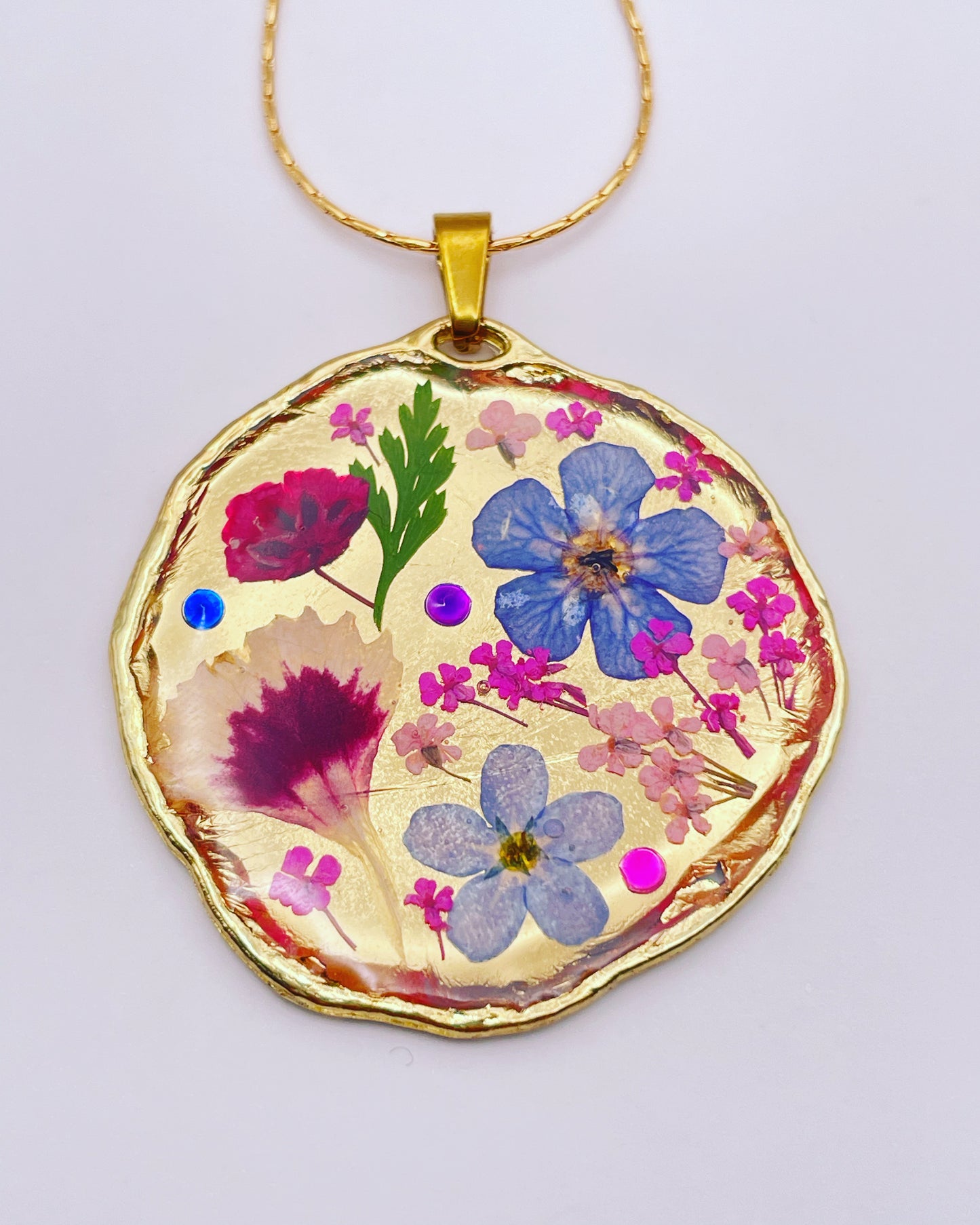 Statement necklace with real flowers and gold leaf