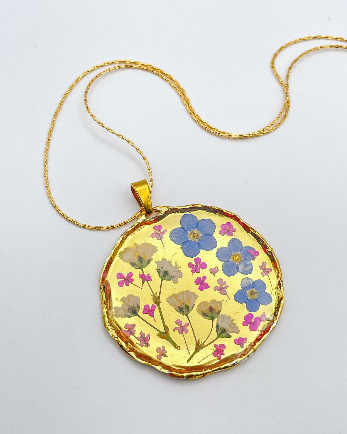Gold necklace with forget-me-not and gypsophila