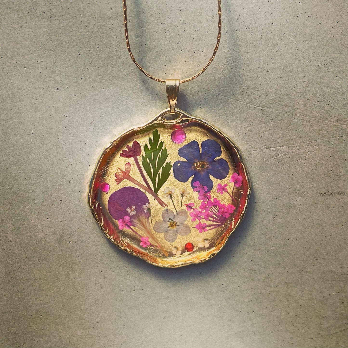 Statement necklace with real flowers and gold leaf