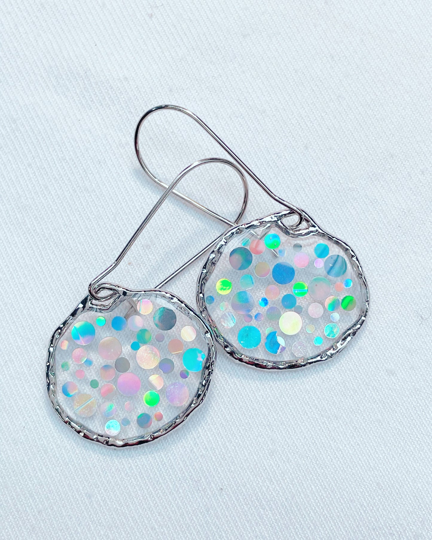 Small disco earrings with holographic silver sparkles