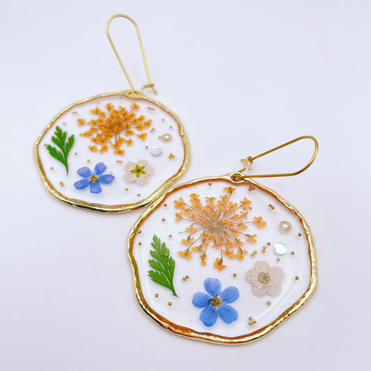 Statement earrings with forget-me-not and orange flowers