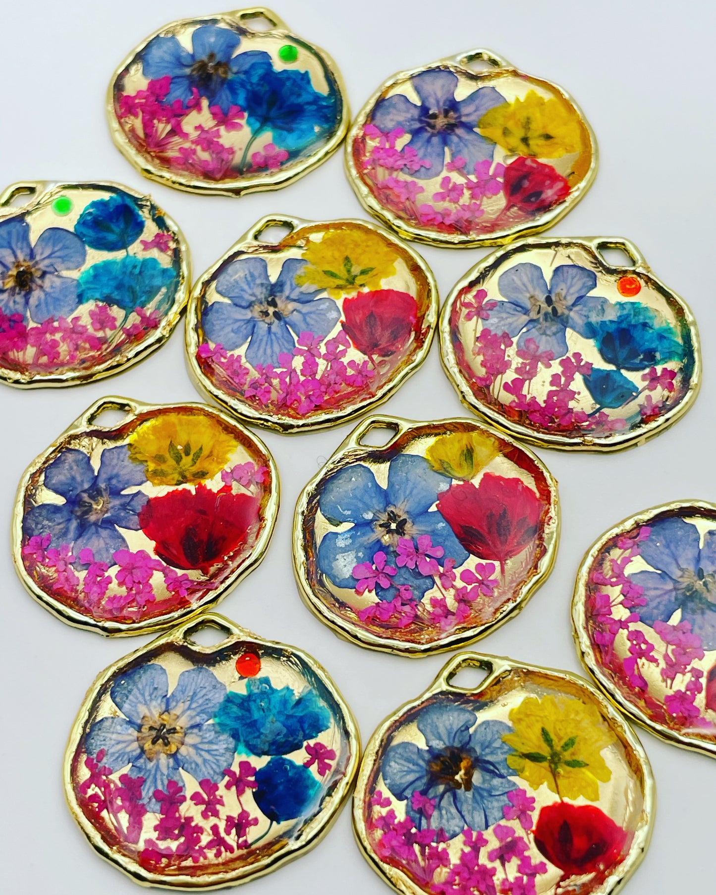 Gold dangle earrings with red and blue flowers