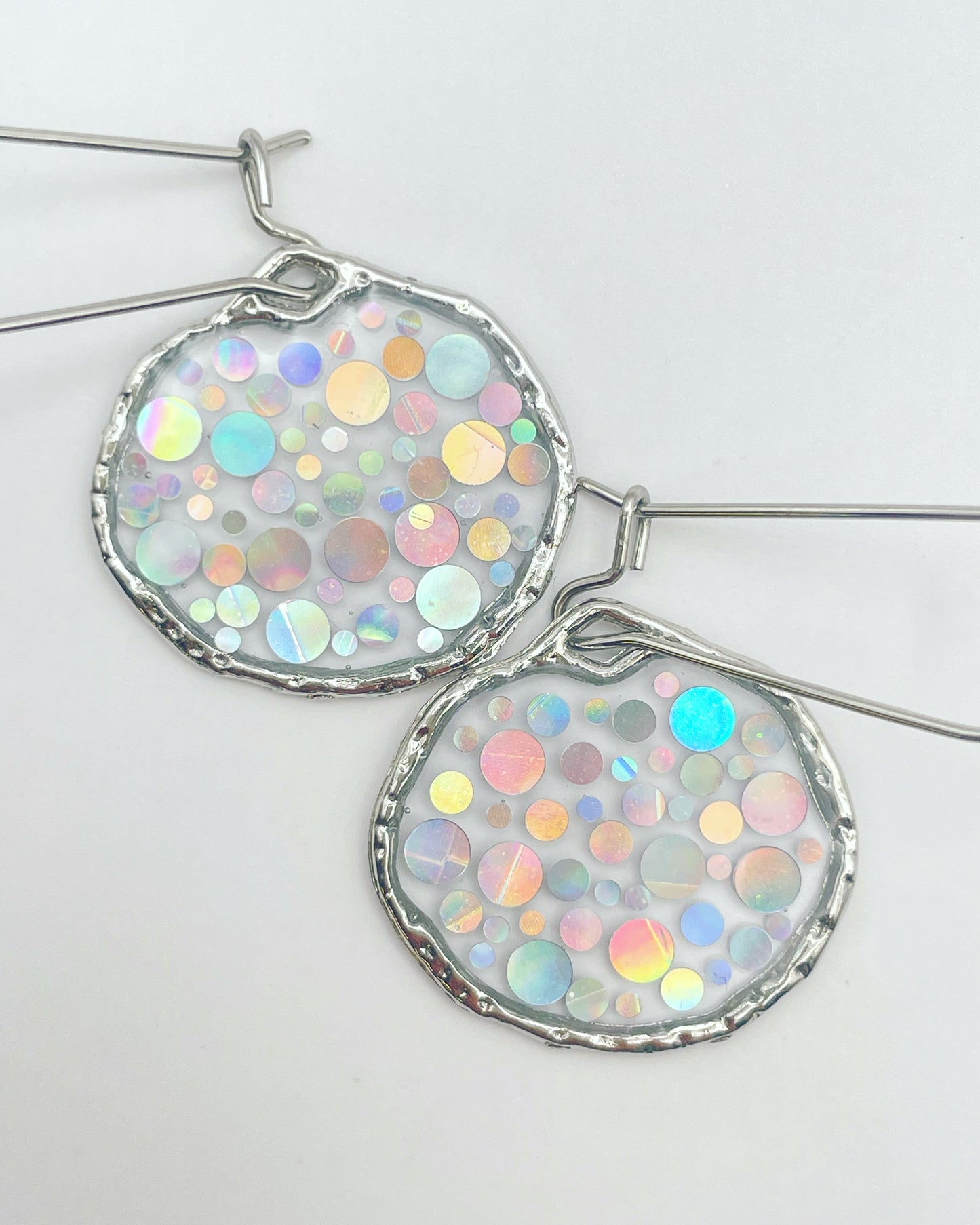 Small disco earrings with holographic silver sparkles