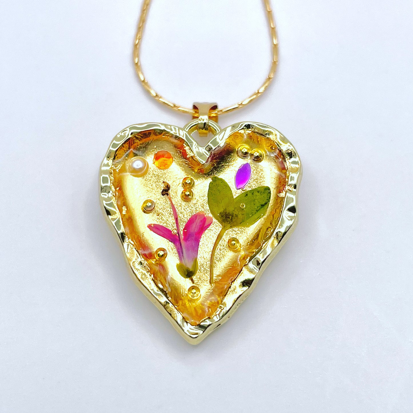 Gold heart necklace with pink flowers