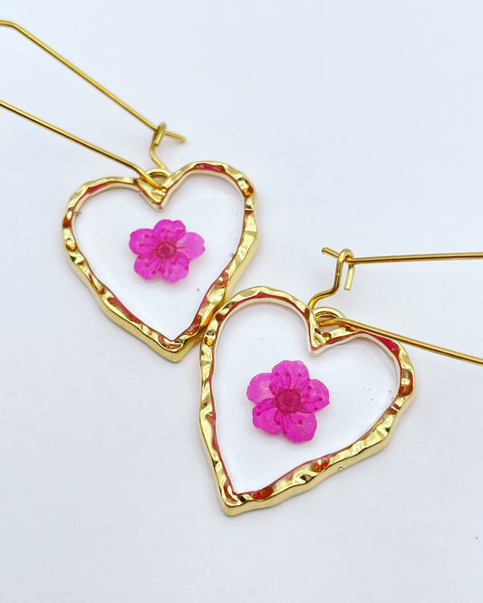 Heart dangle earrings with bright pink flowers