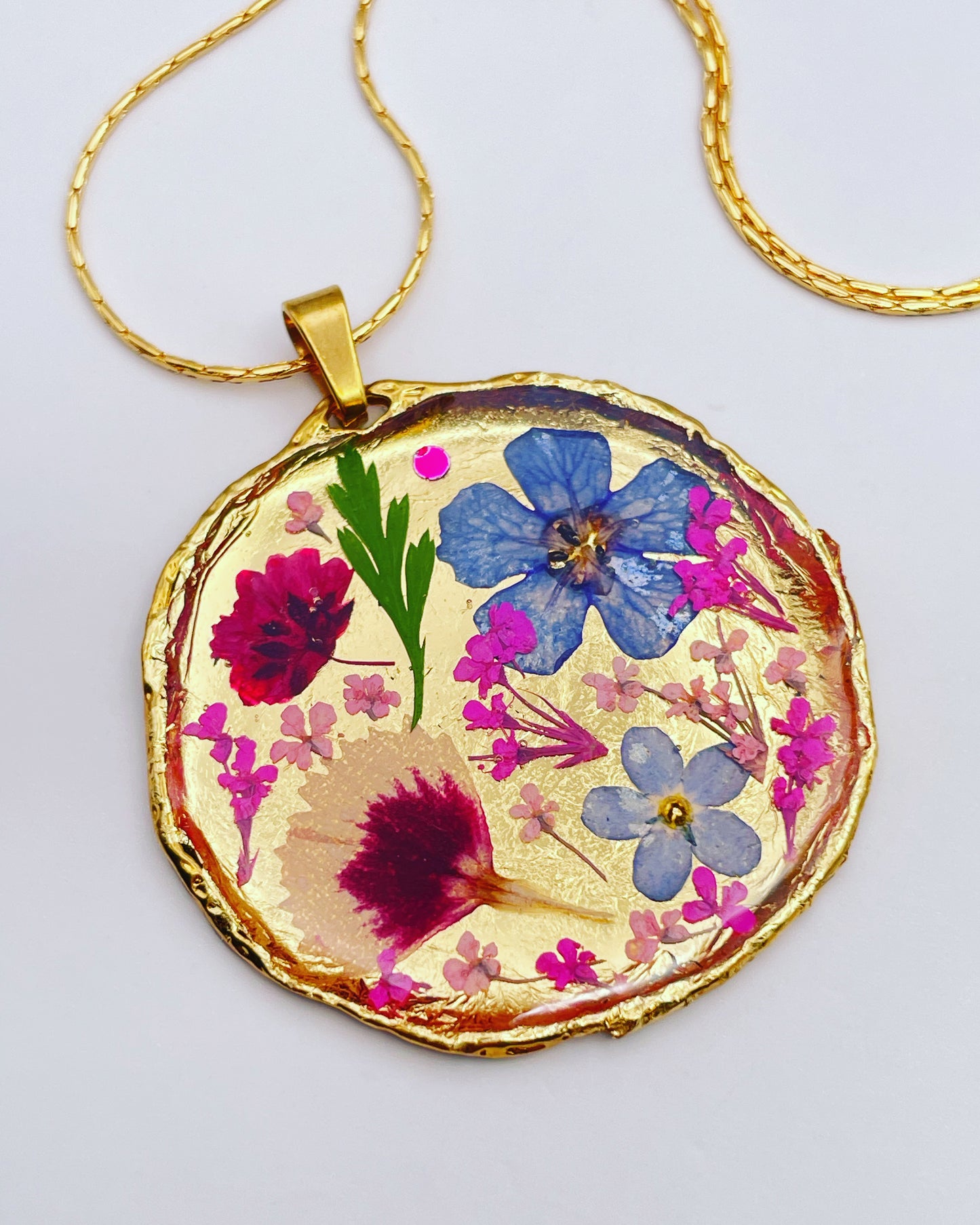 Statement necklace with real flowers and gold leaf