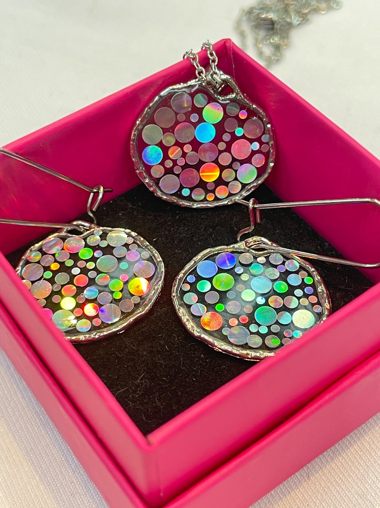 Small disco earrings with holographic silver sparkles