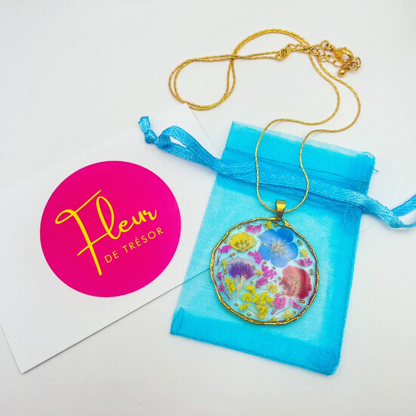 Black heart pendant necklace with real flowers and gold leaf