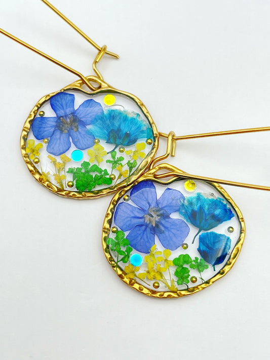 Dangle earrings with real blue flowers in gold or silver