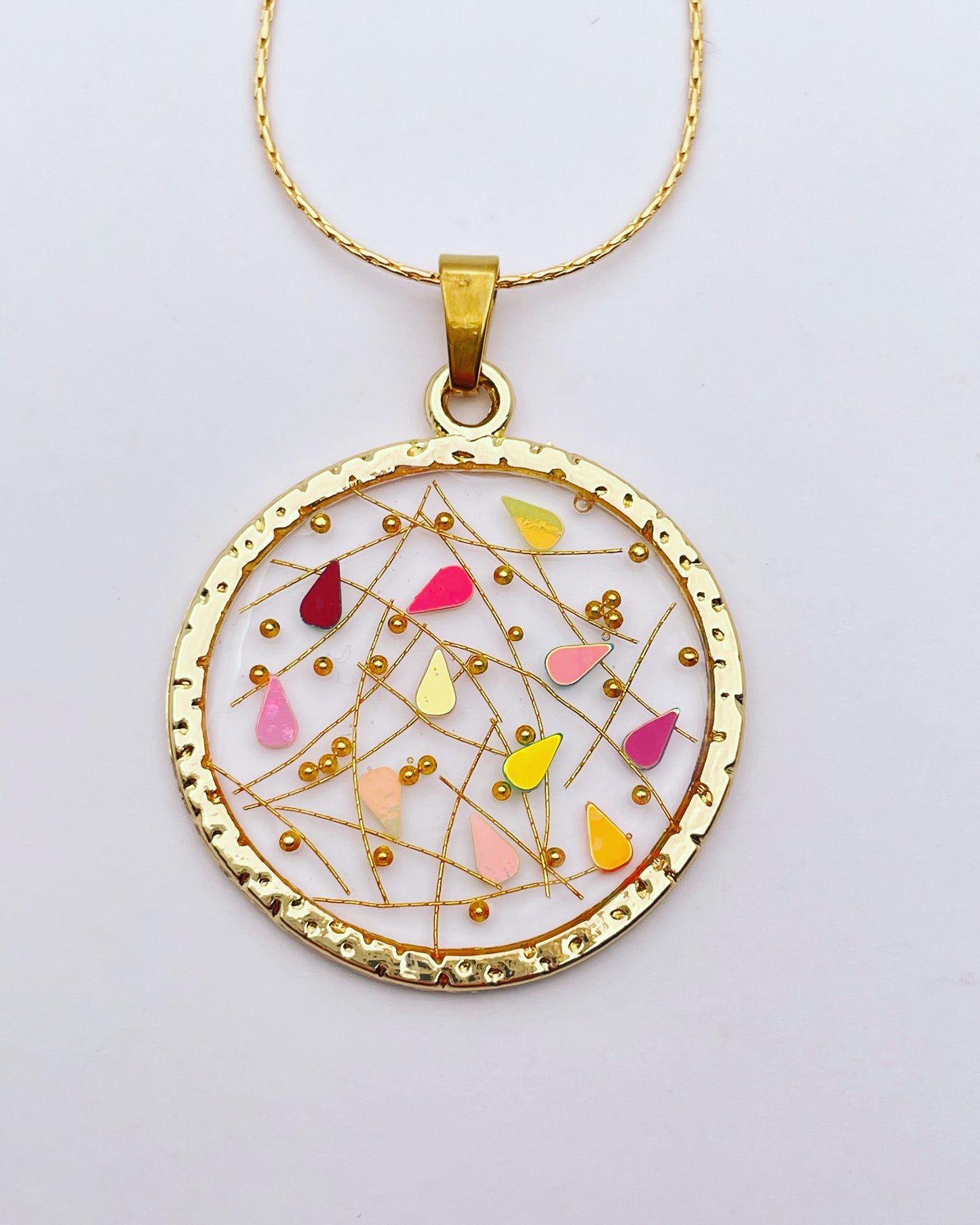 Elegant disco pendant necklace with gold sparkles