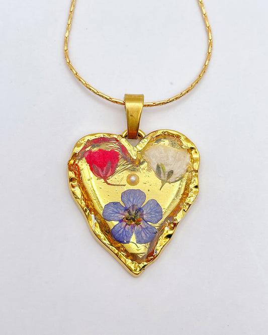 Gold heart necklace with red poppies and blue flowers