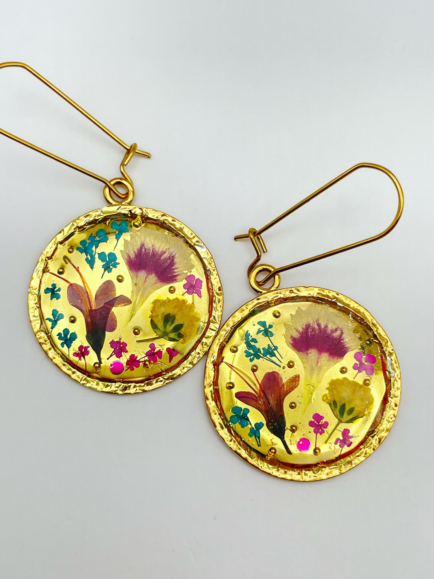 Gold dangle earrings with real pink flowers and gold leaf