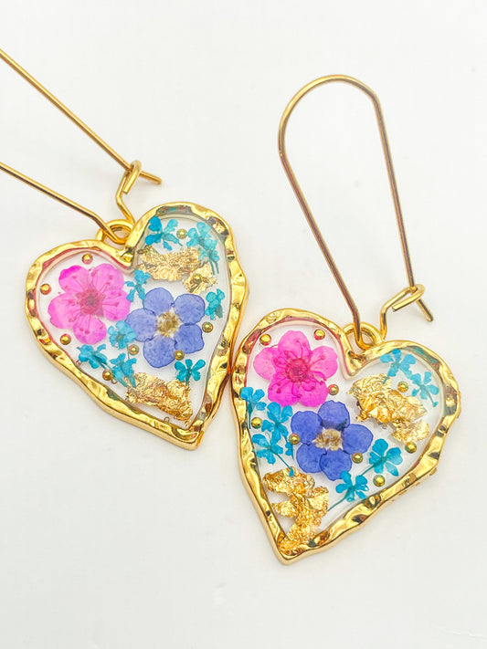 Heart dangle earrings with forget-me-not and pink flowers