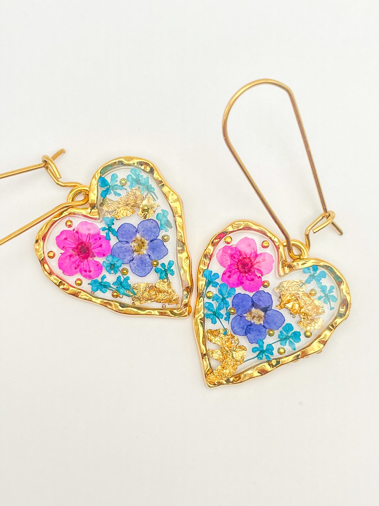 Heart dangle earrings with forget-me-not and pink flowers