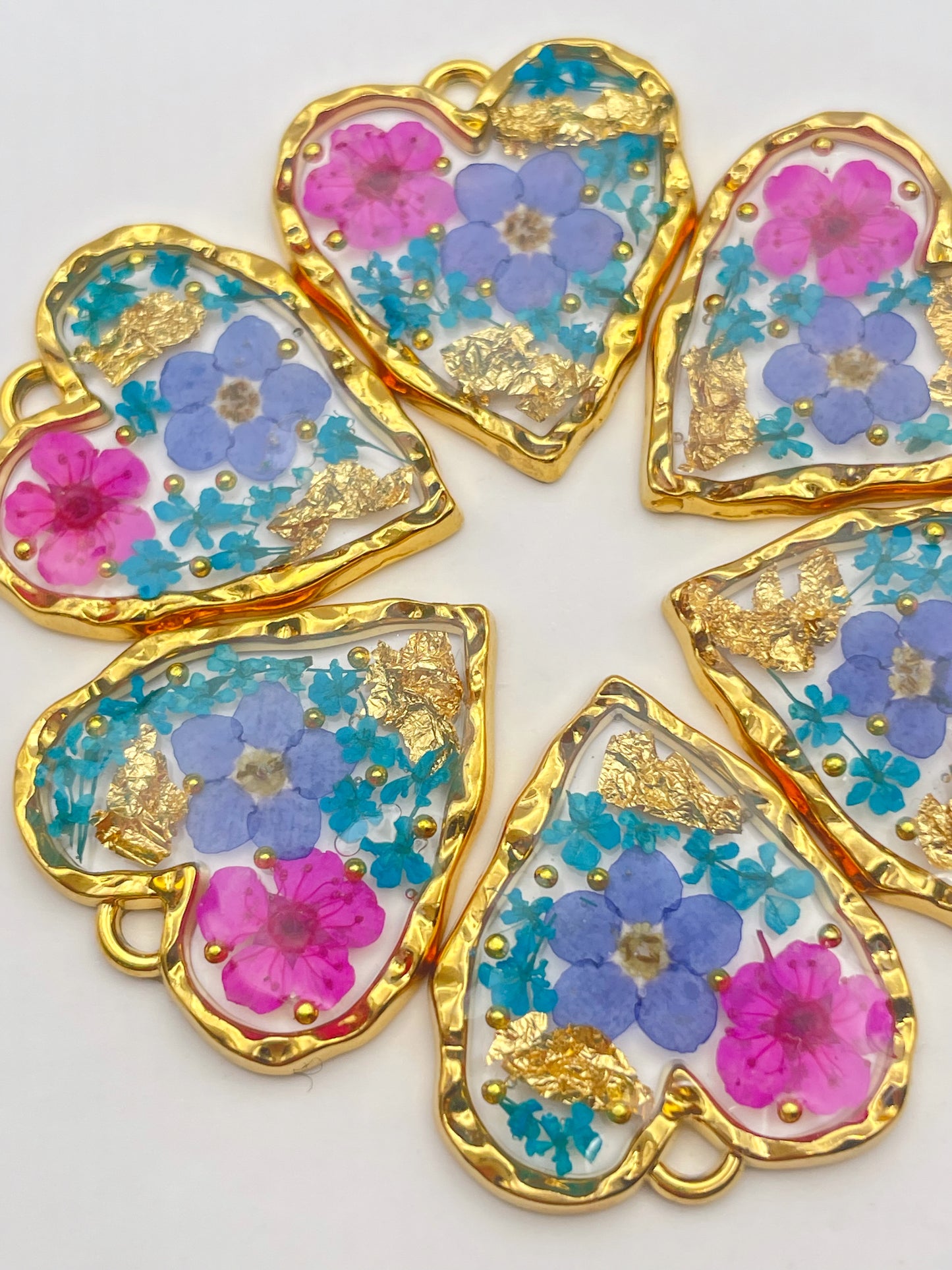 Heart necklace with forget-me-not and pink flowers