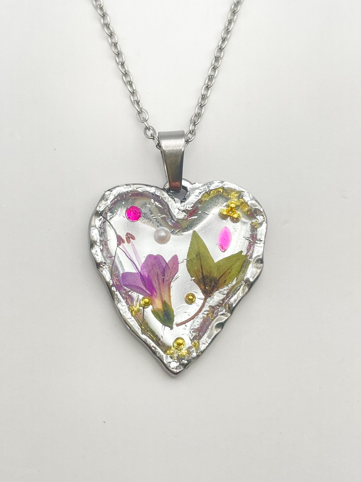 Silver heart necklace with pink flowers
