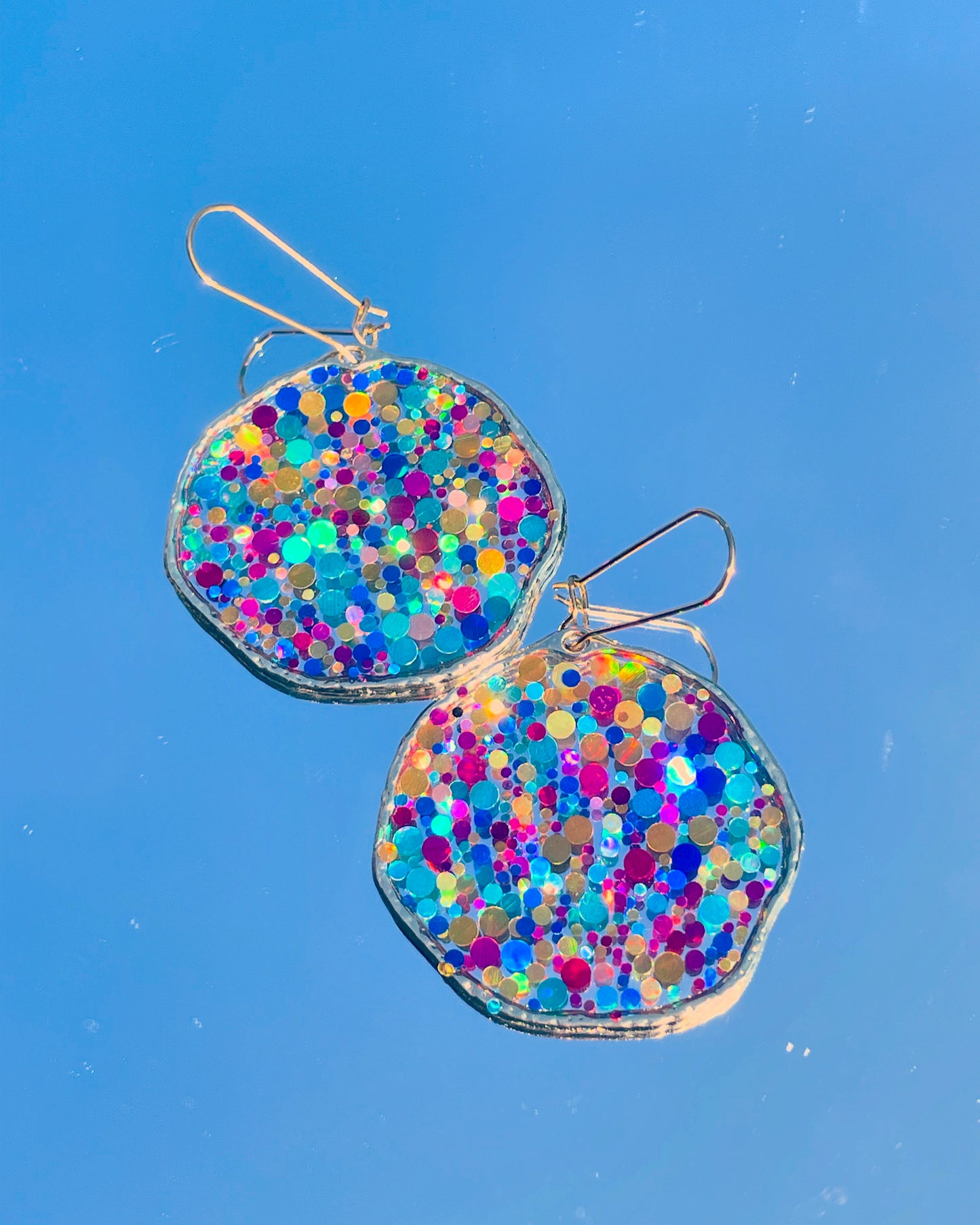 Large disco earrings with colourful sparkles