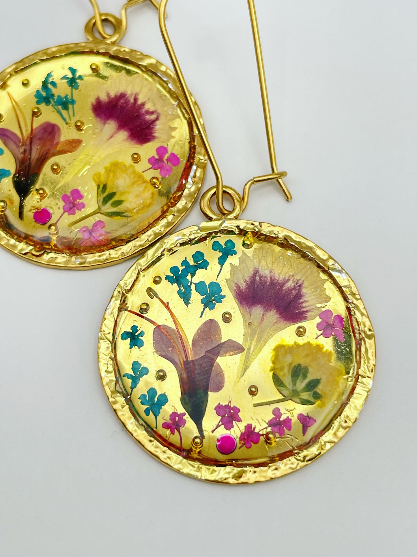 Gold dangle earrings with real pink flowers and gold leaf
