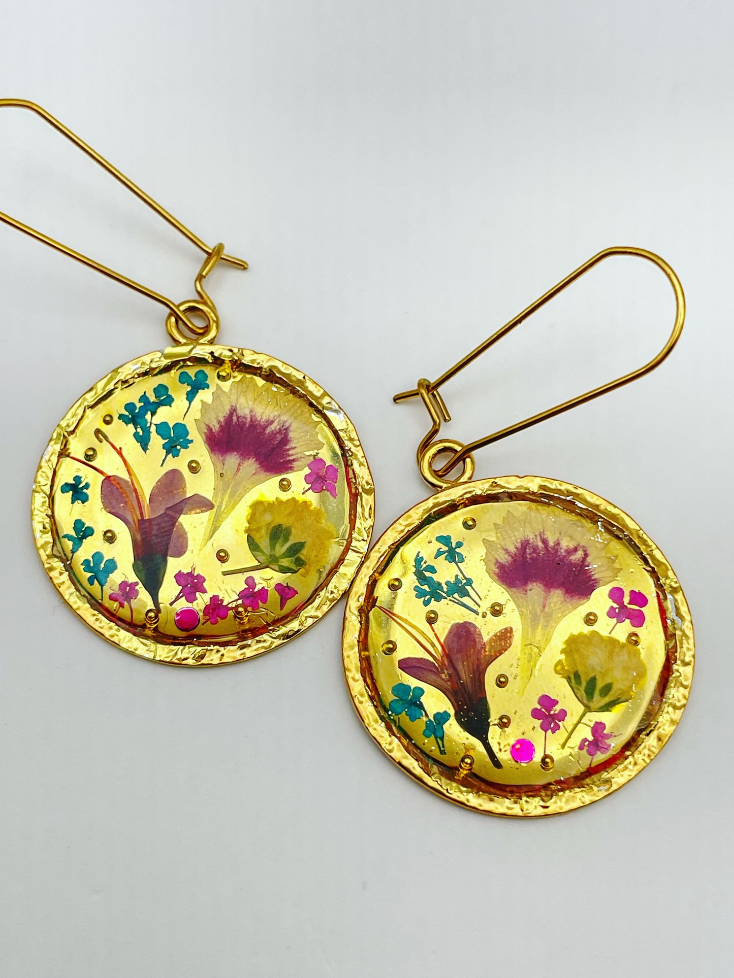Gold dangle earrings with real pink flowers and gold leaf
