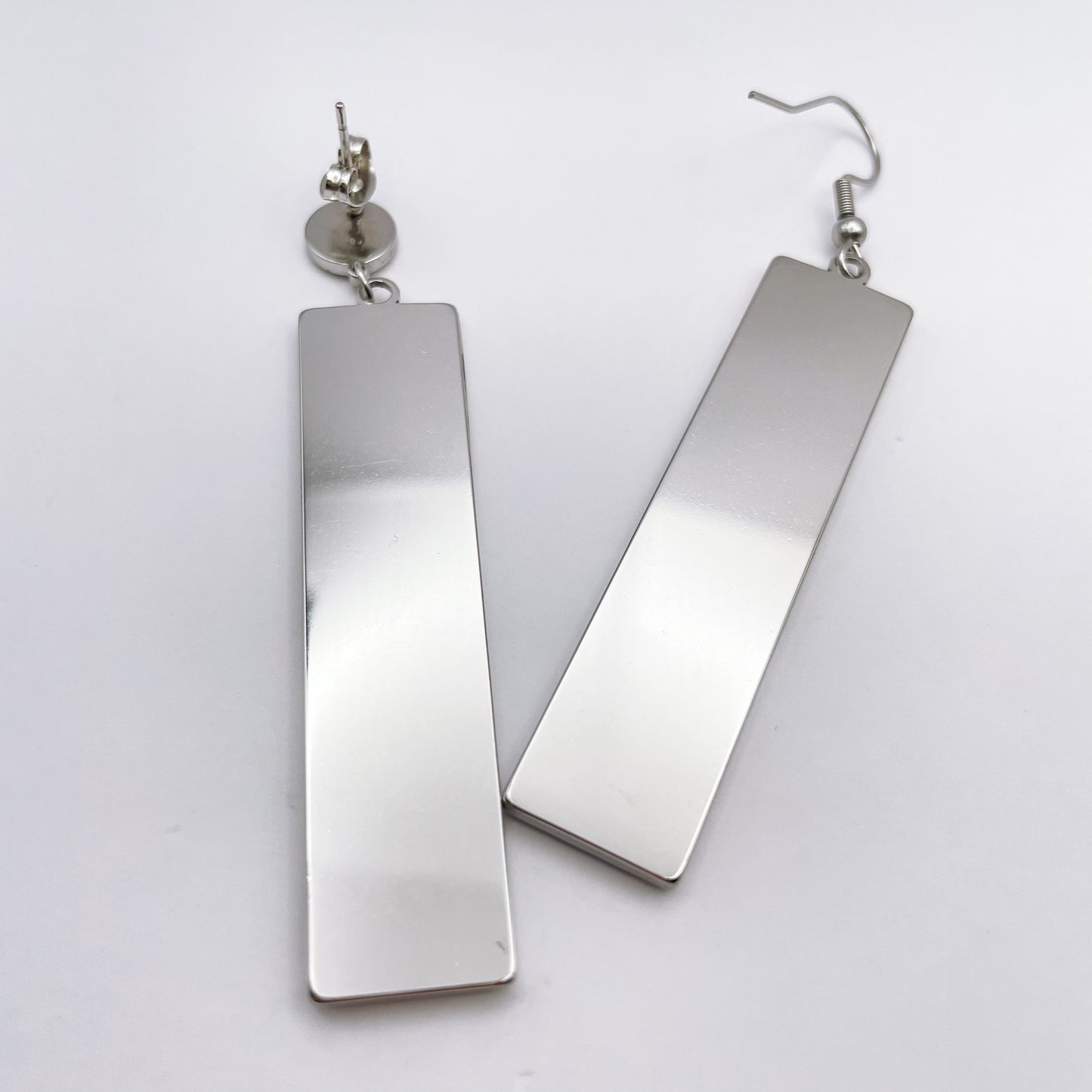 Long disco earrings with colourful sparkles in black lacquer