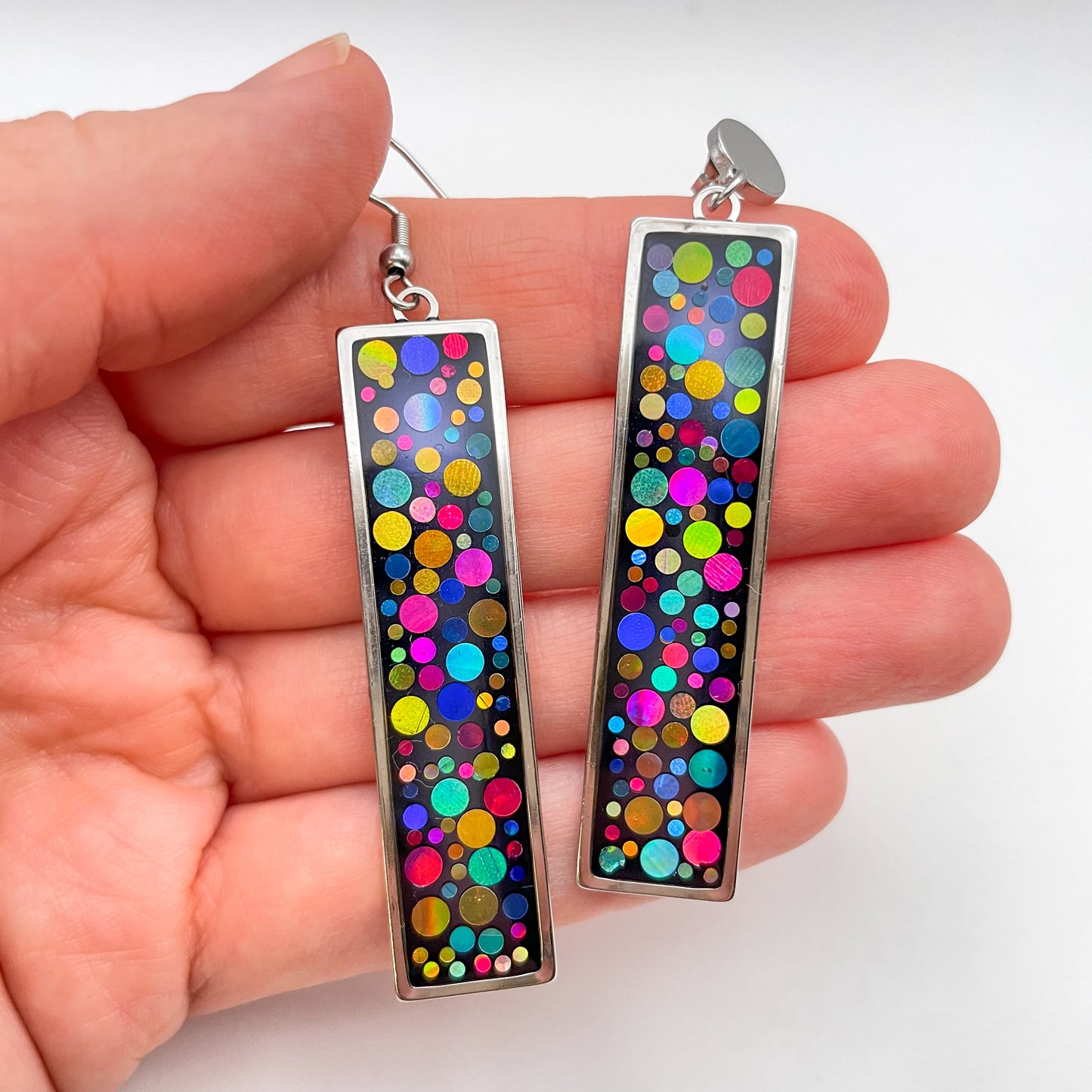 Long disco earrings with colourful sparkles in black lacquer