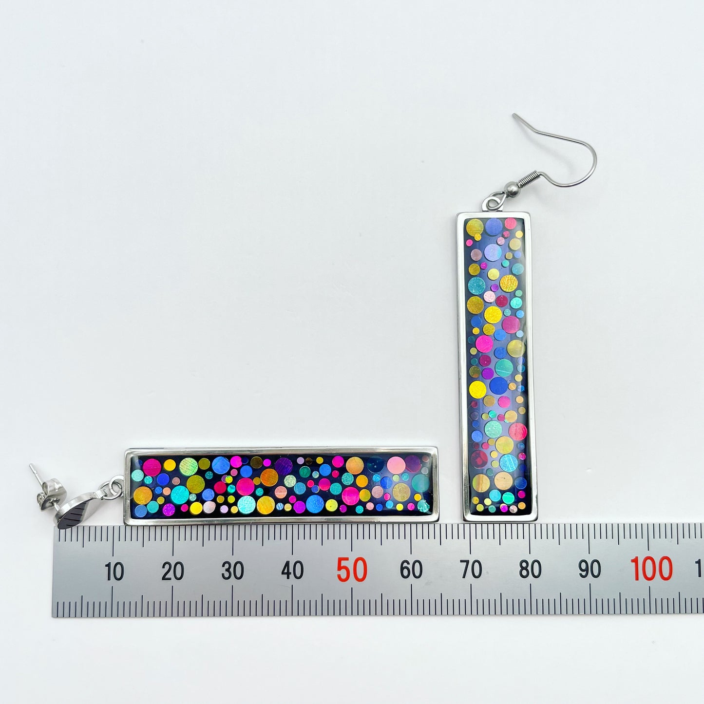Long disco earrings with colourful sparkles in black lacquer