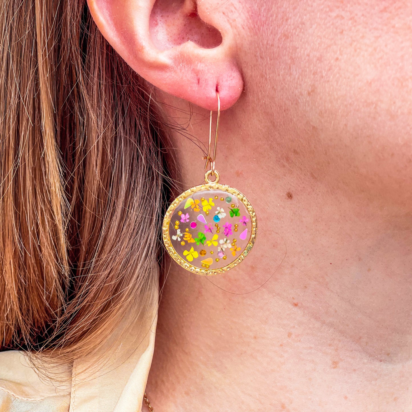 Gold dangle earrings with real pink flowers and gold leaf