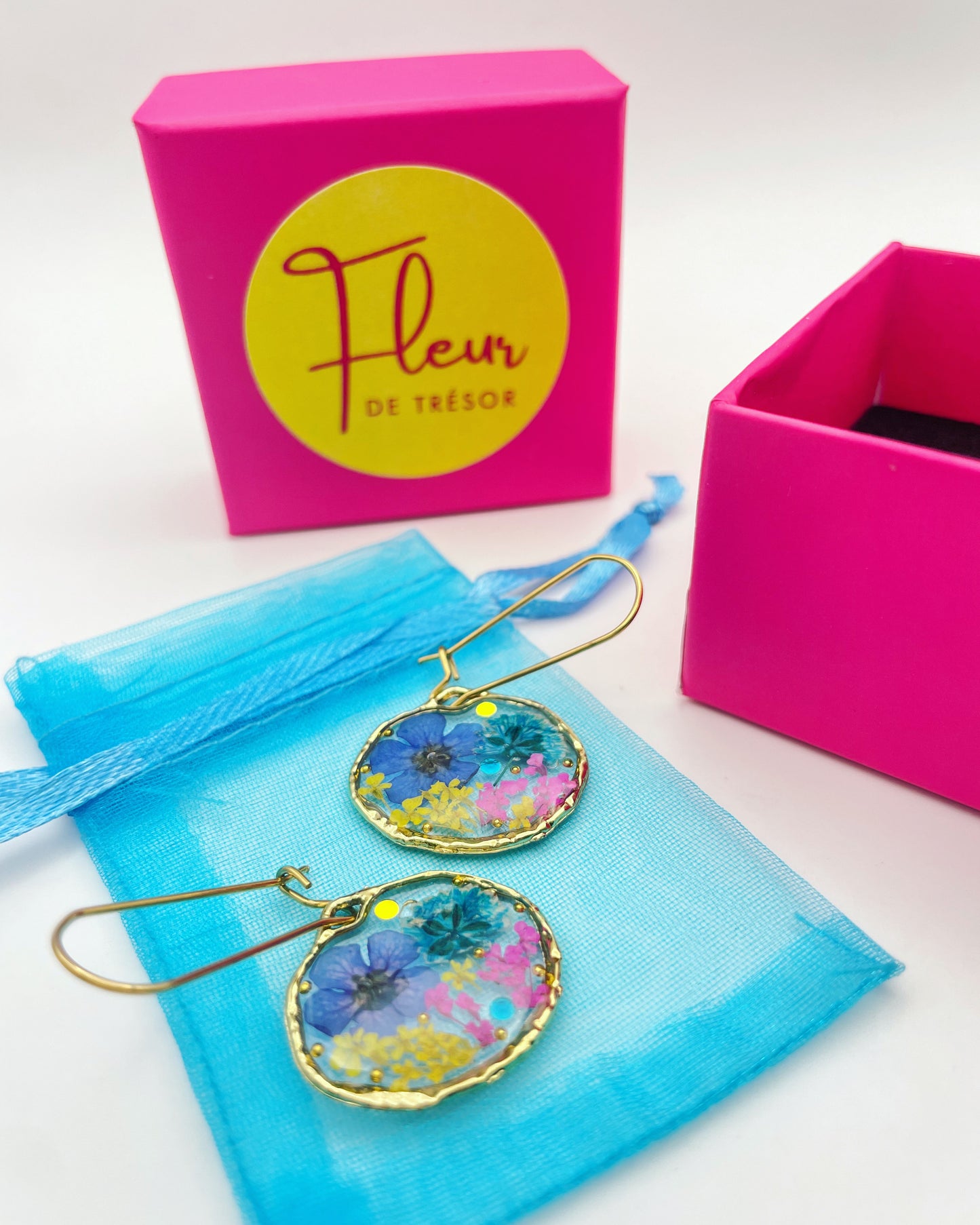 Gold dangle earrings with real pink flowers and gold leaf