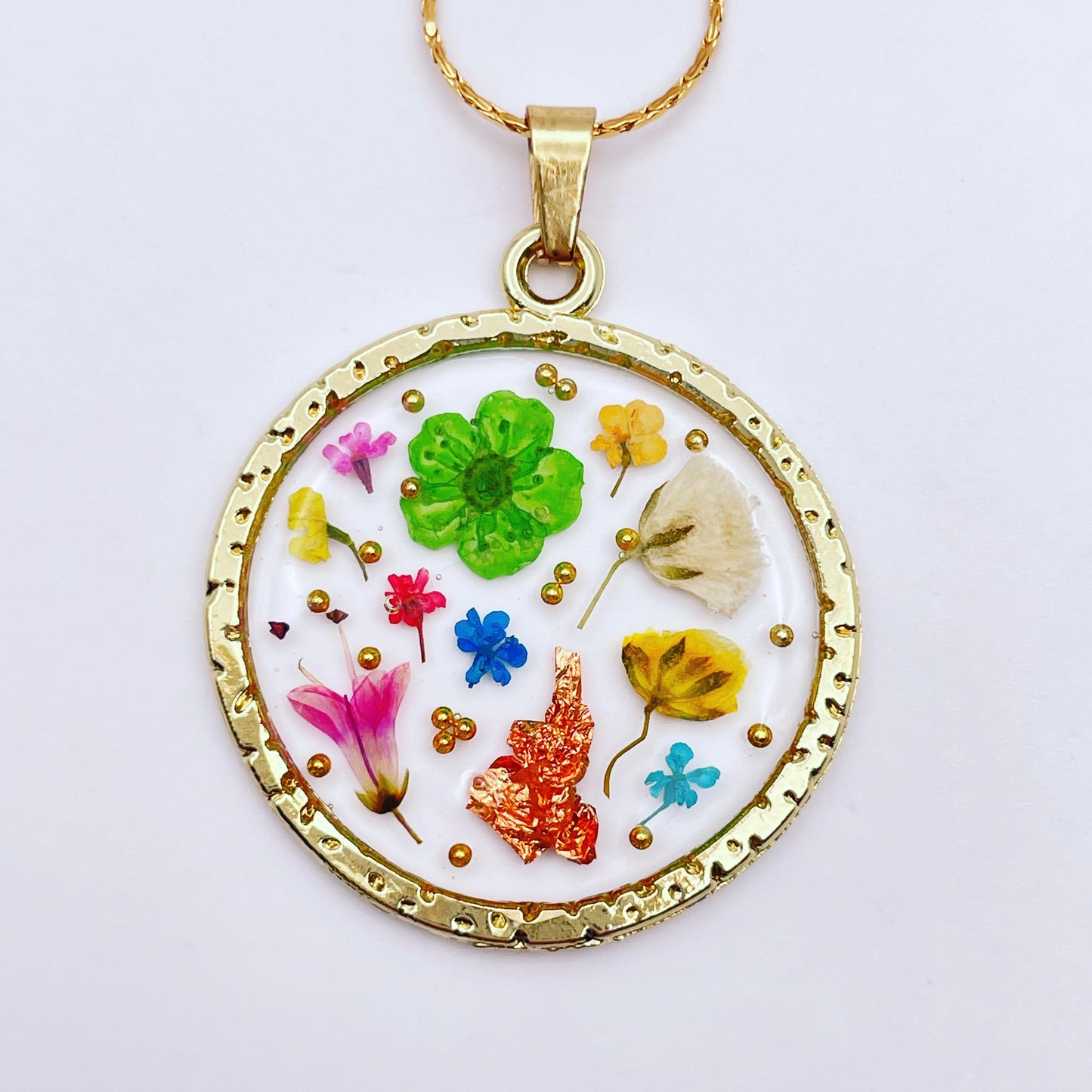 Statement earrings with colourful flowers in gold