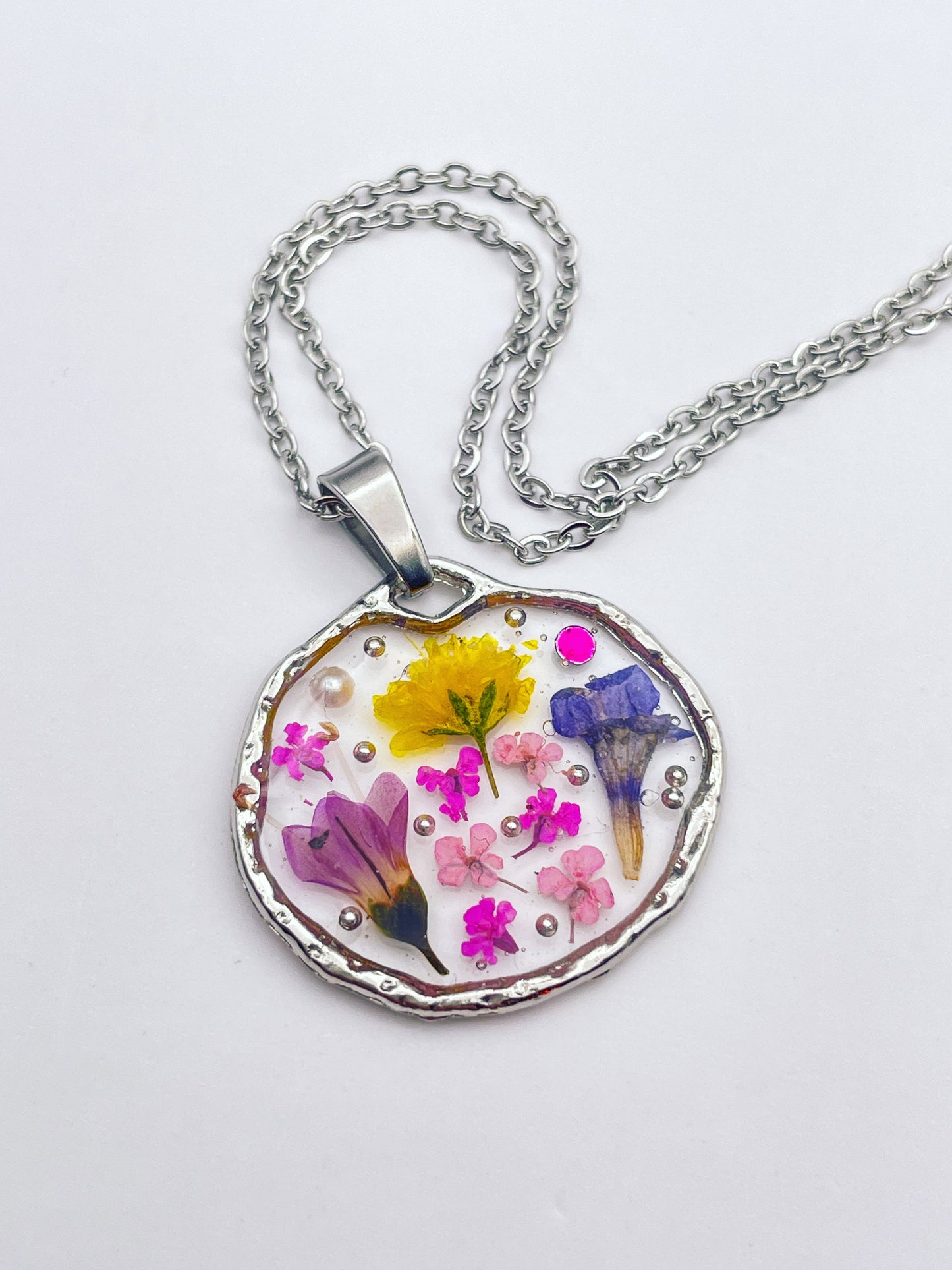 Pendant necklace with lavender and pink flowers