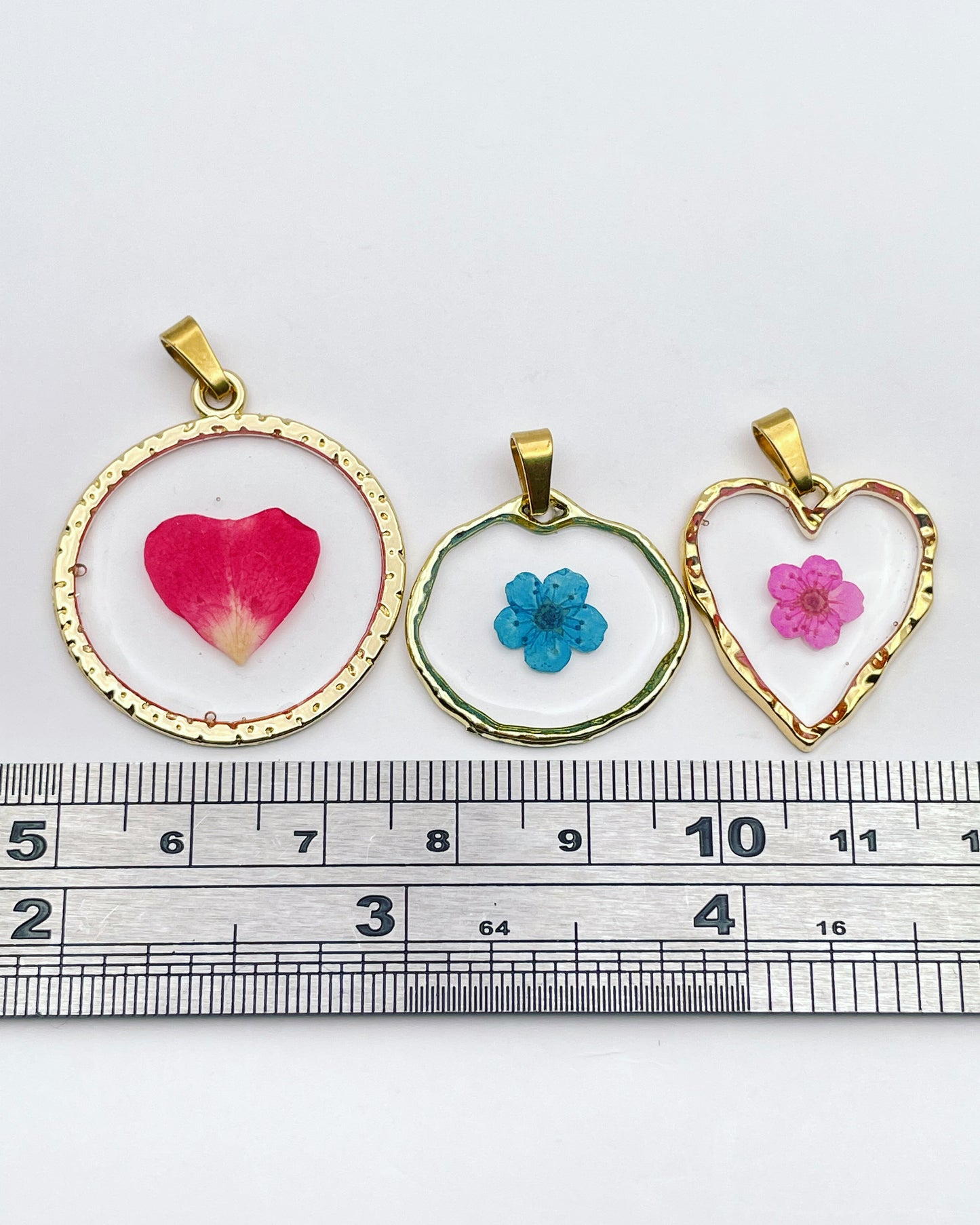 Gold dangle earrings with real pink flowers and gold leaf