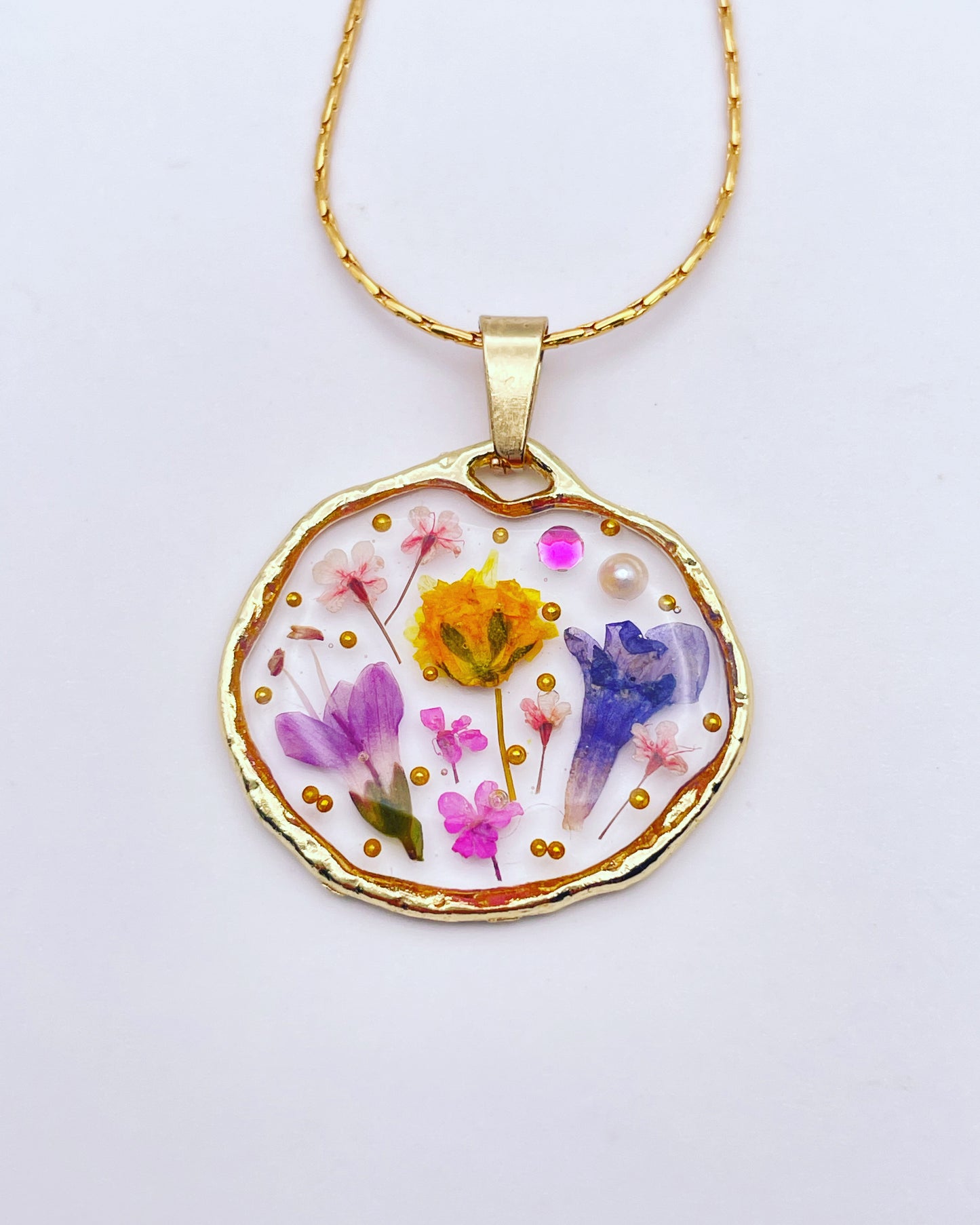 Pendant necklace with lavender and pink flowers