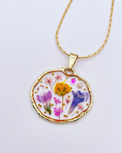 Pendant necklace with lavender and pink flowers