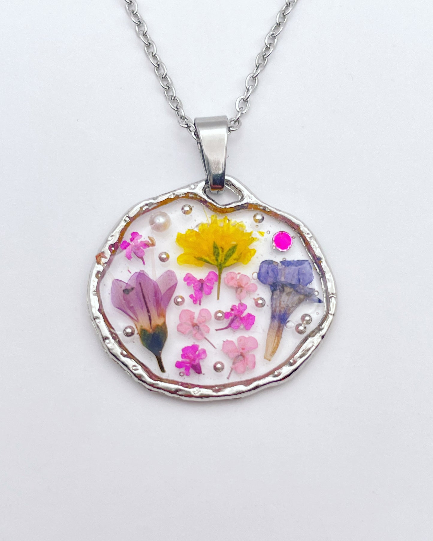 Pendant necklace with lavender and pink flowers