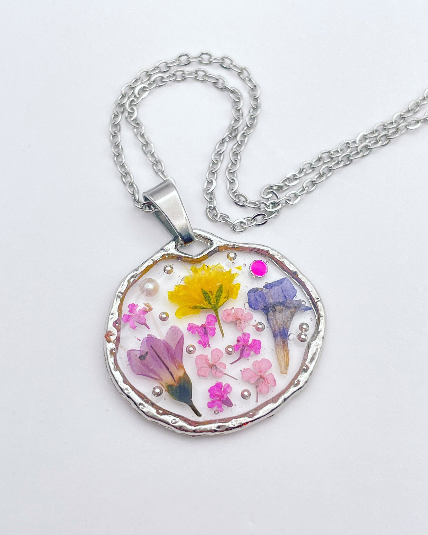 Pendant necklace with lavender and pink flowers